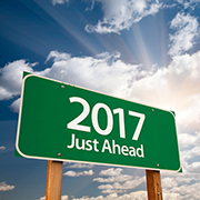 2017 Just Ahead Green Road Sign Against Clouds